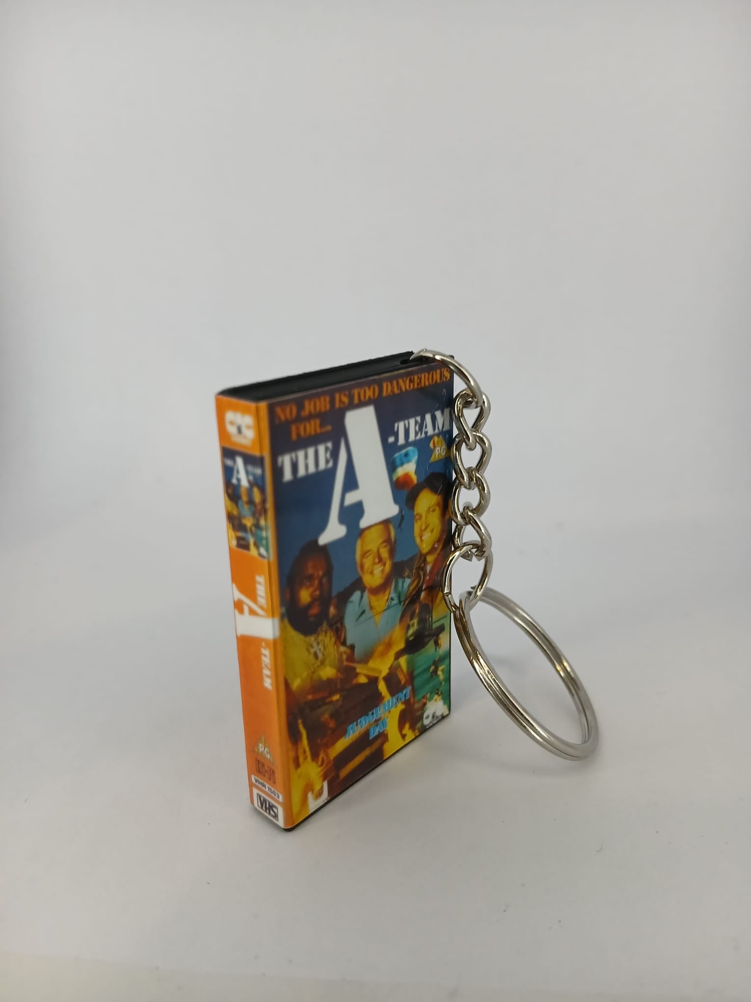 The A-Team VHS keyring — front and spine angled view standing