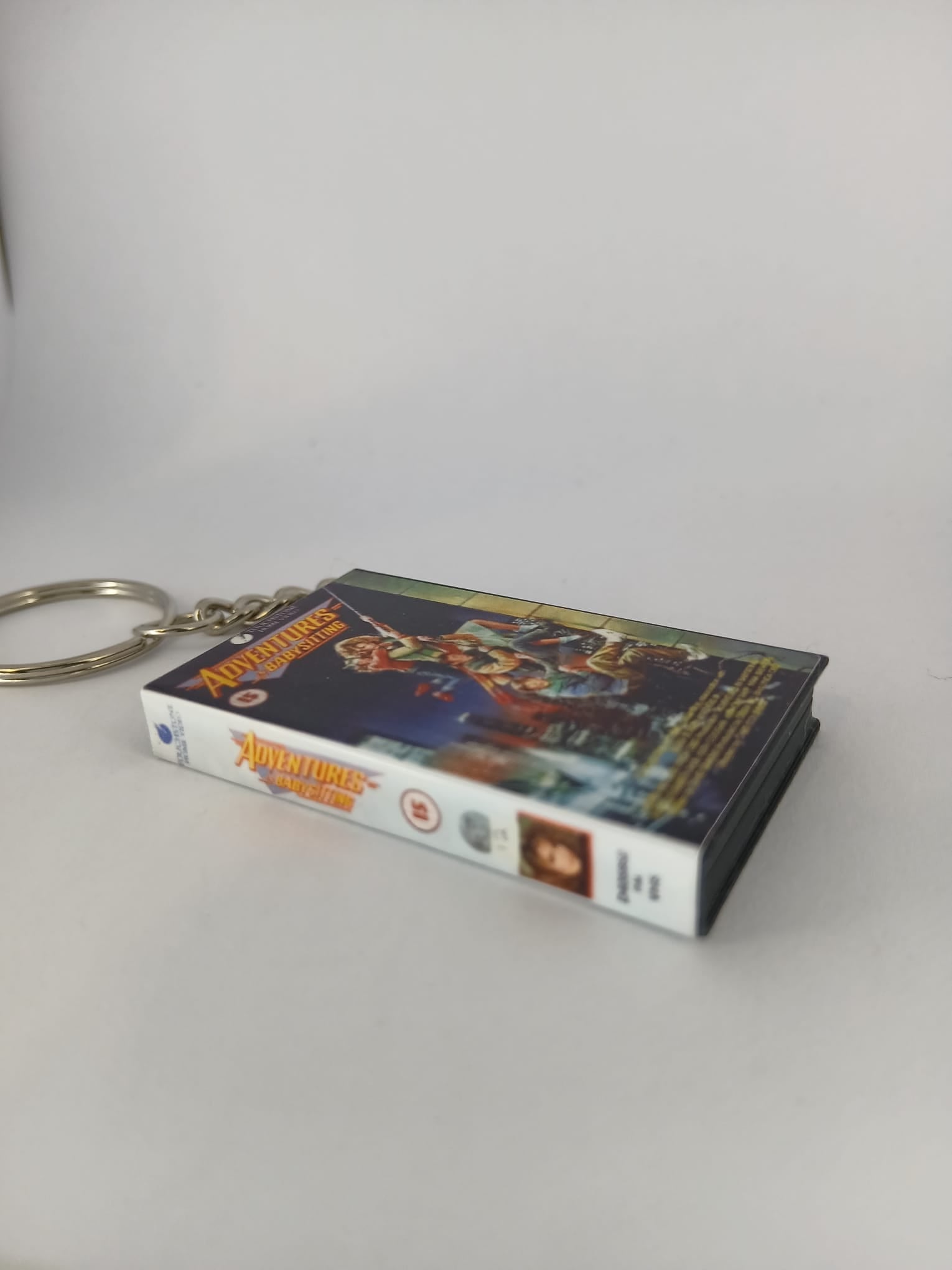 Adventures in Babysitting Mini VHS Keyring – front with coin standing