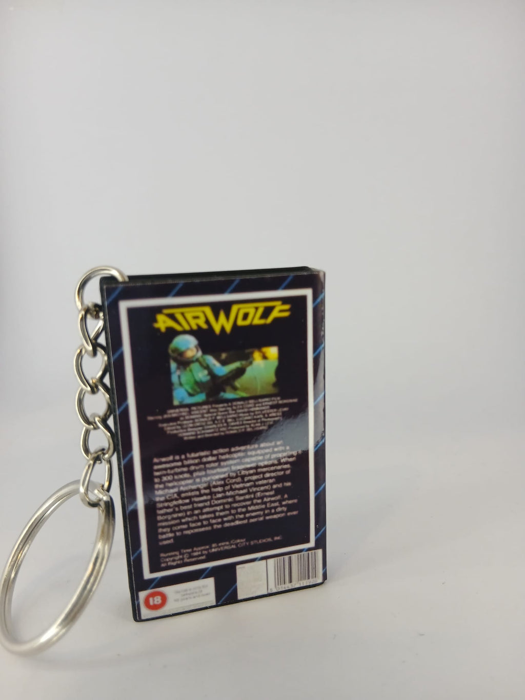 Airwolf VHS keyring — flat lay angled view