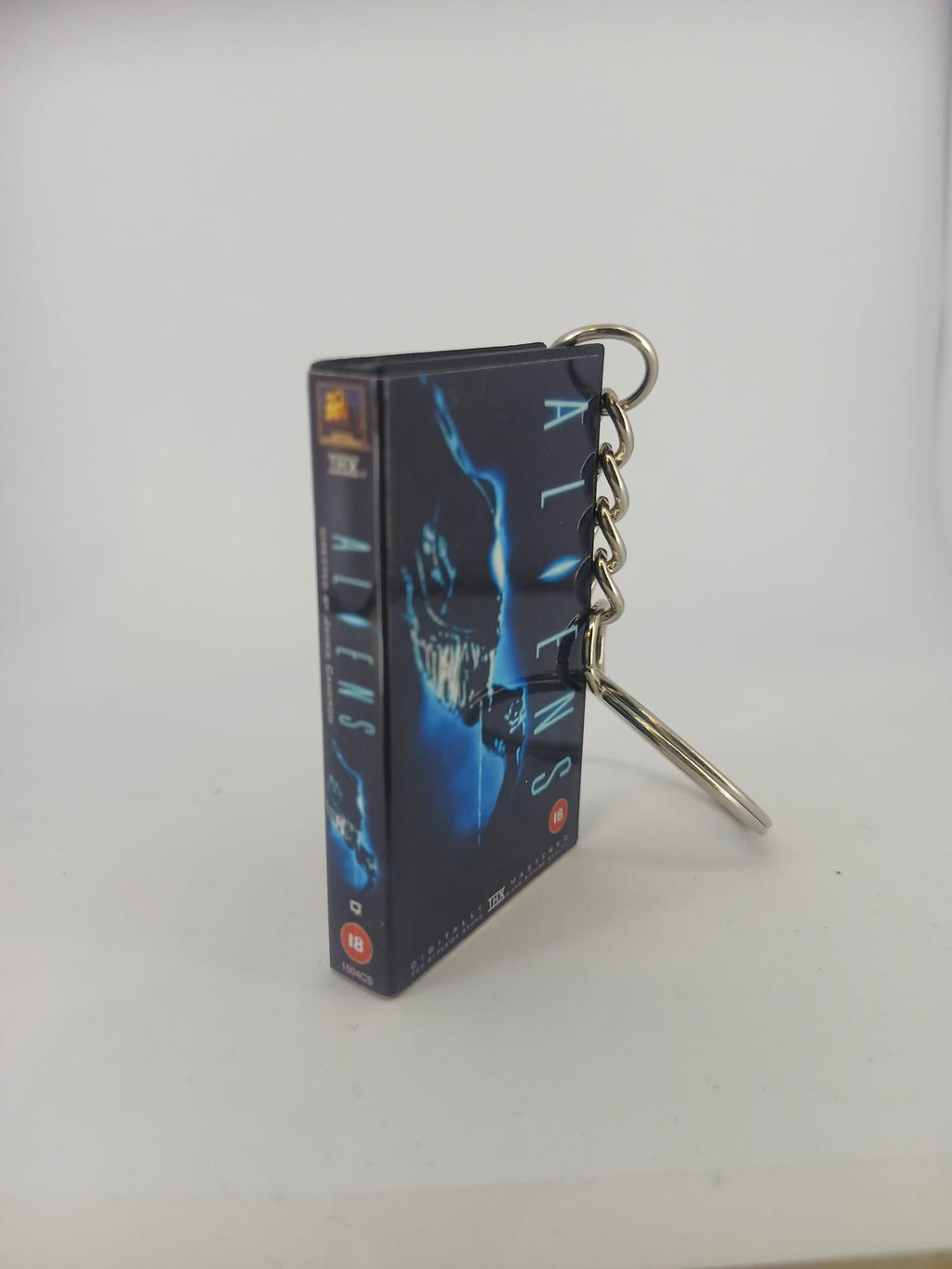 Aliens VHS keyring — front cover standing angled 2