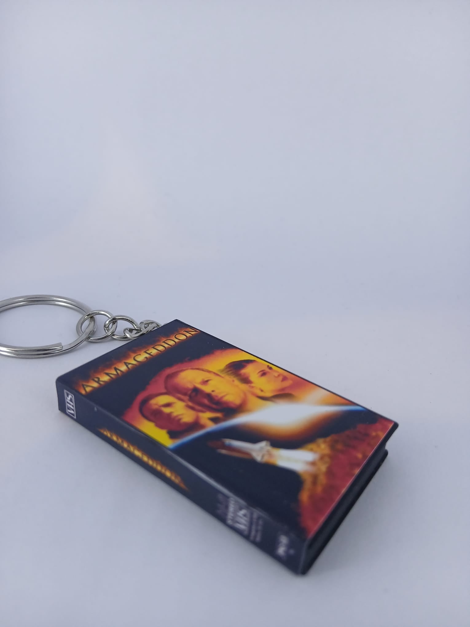 Armageddon VHS keyring — spine view standing