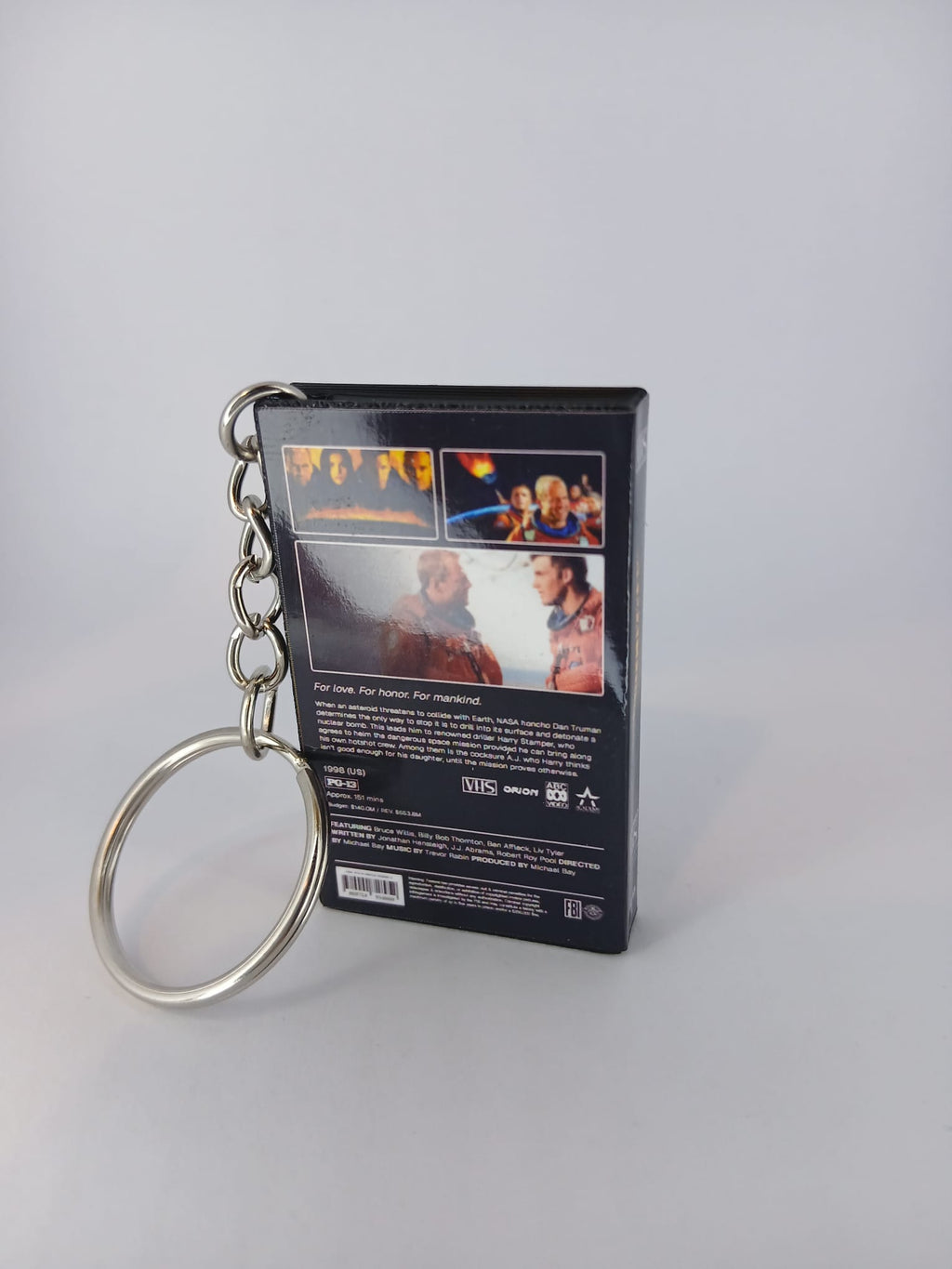 Armageddon VHS keyring — back and spine angled view