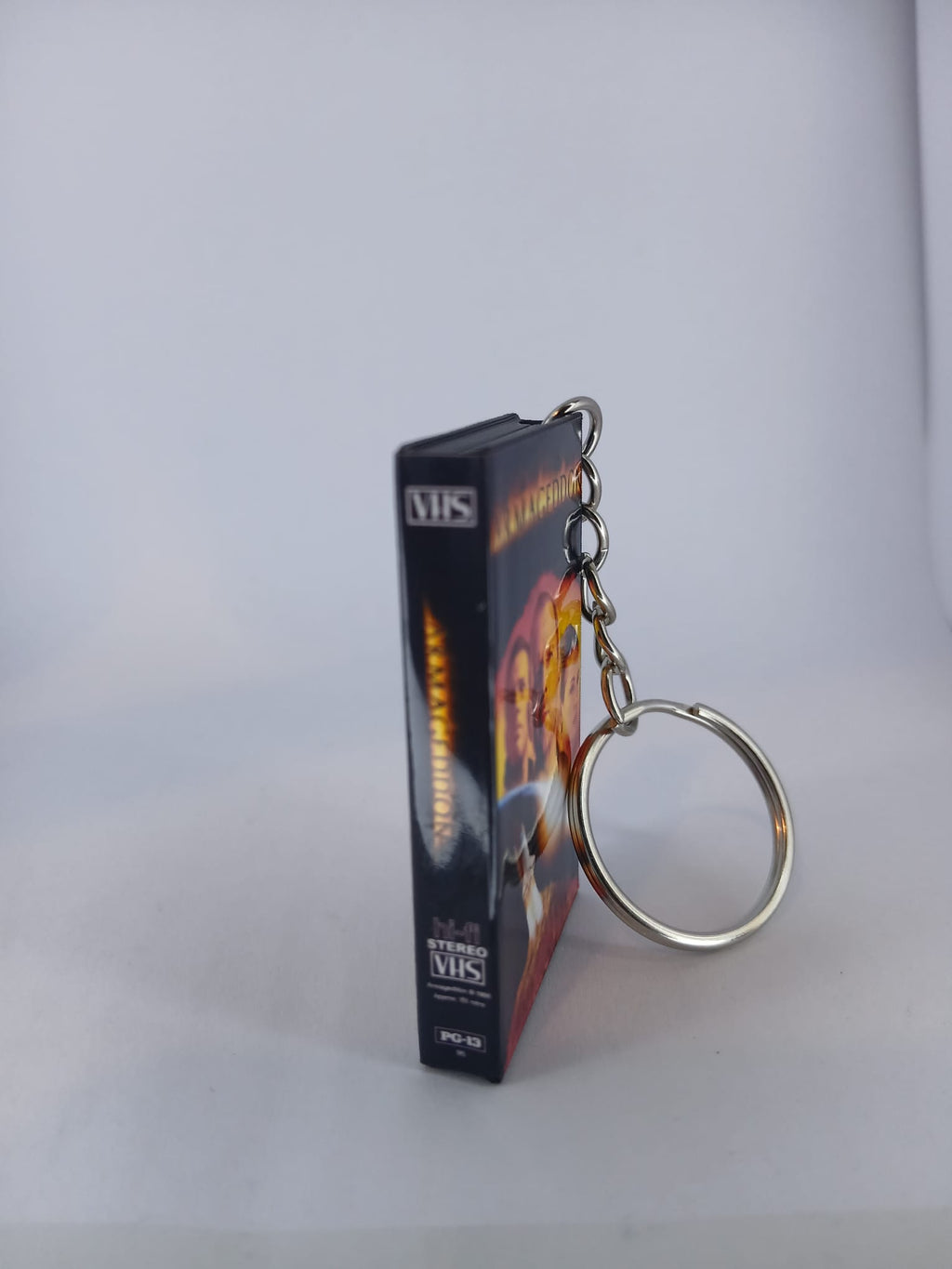 Armageddon VHS keyring — front cover flat lay angled 2