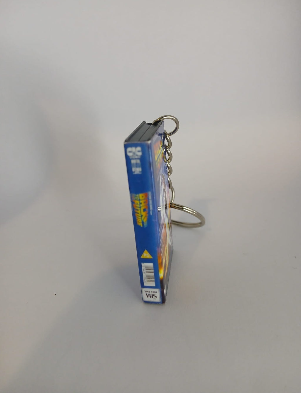 Back to the Future Mini VHS Keyring – front with coin standing