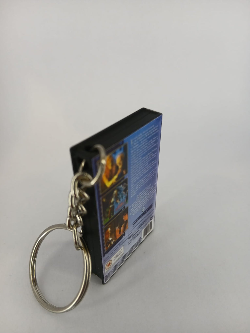 Beetlejuice VHS keyring — front and spine flat lay angled