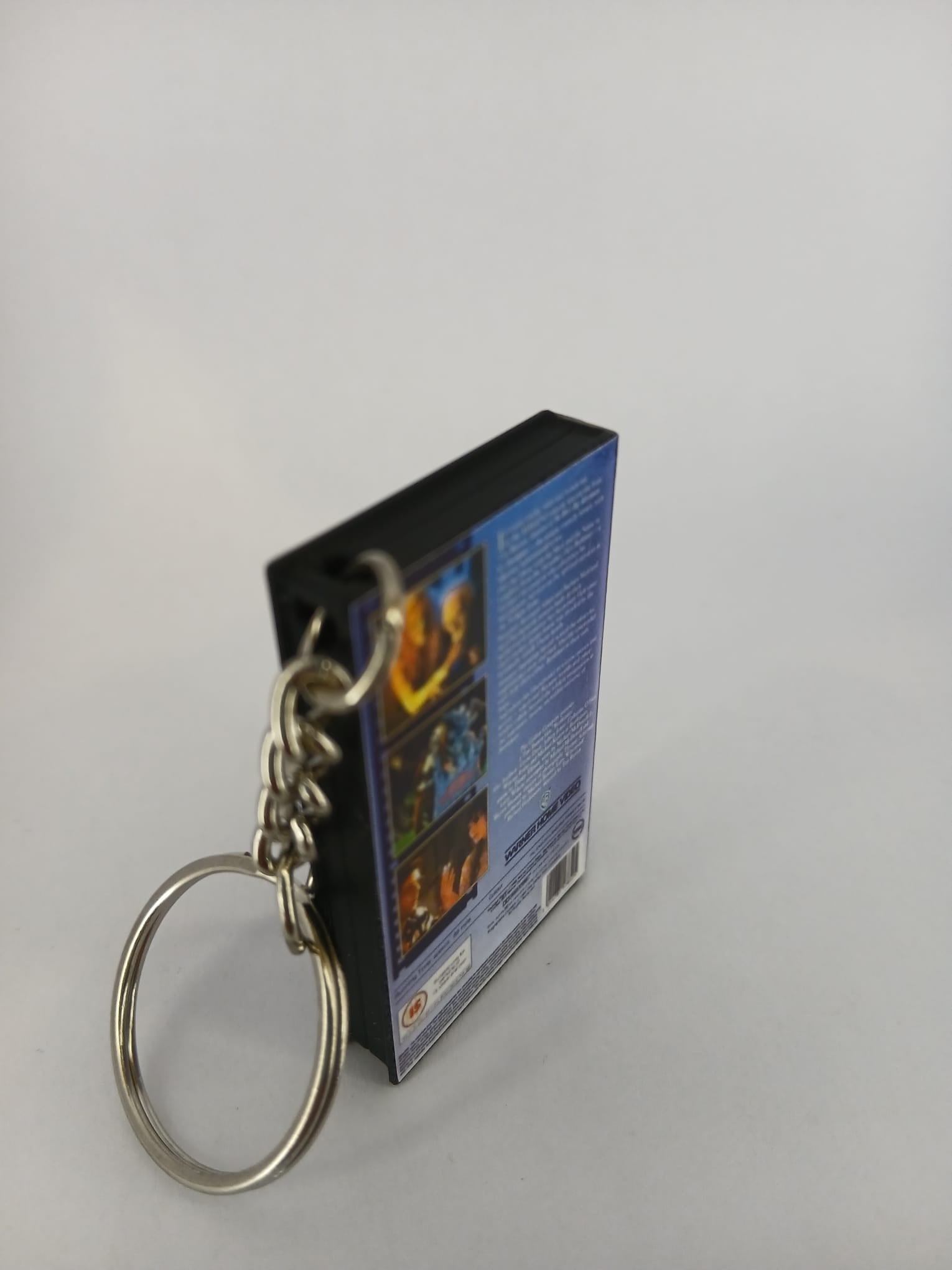 Beetlejuice VHS keyring — front and spine flat lay angled