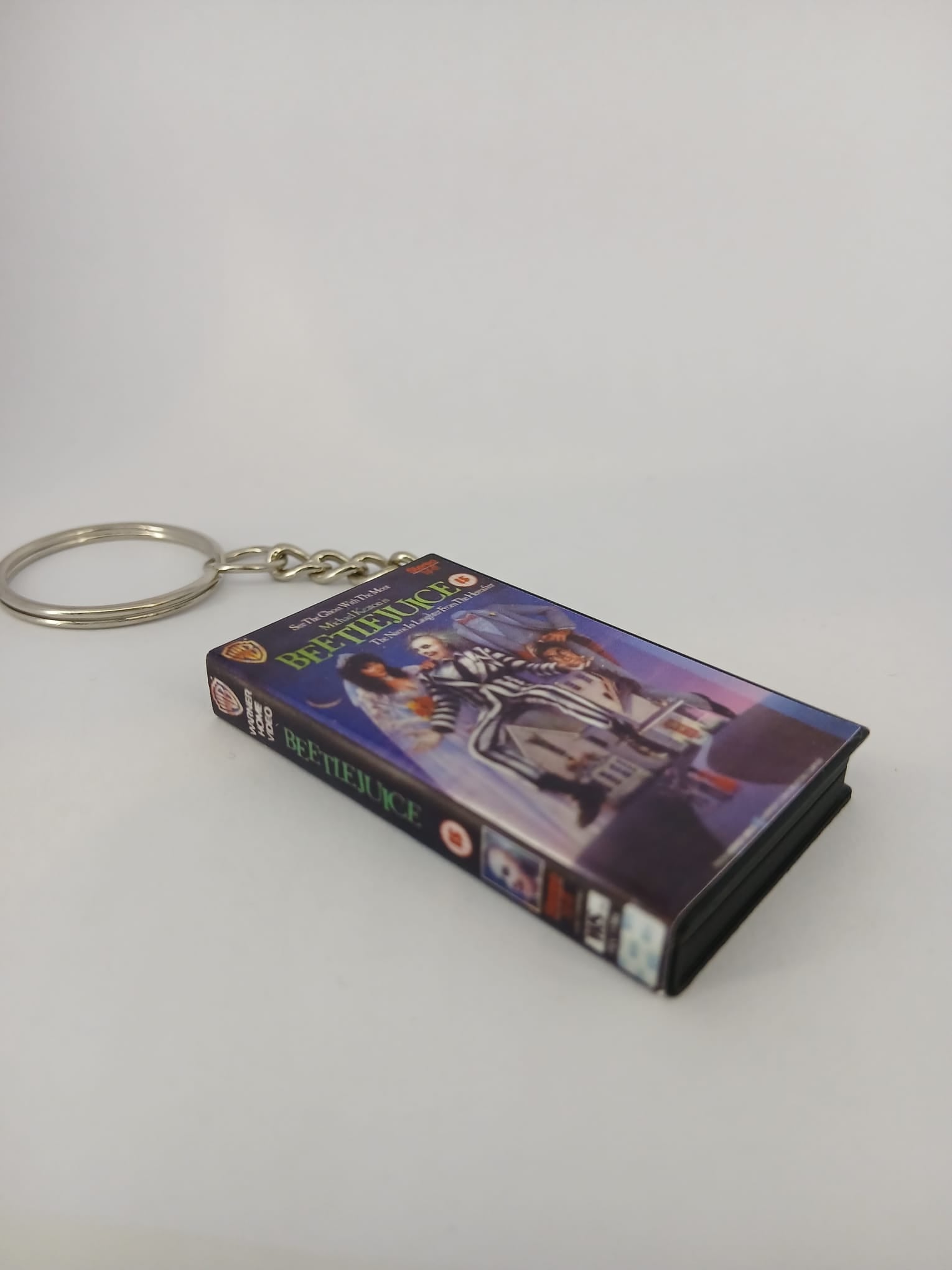 Beetlejuice VHS keyring — front cover standing angled 2