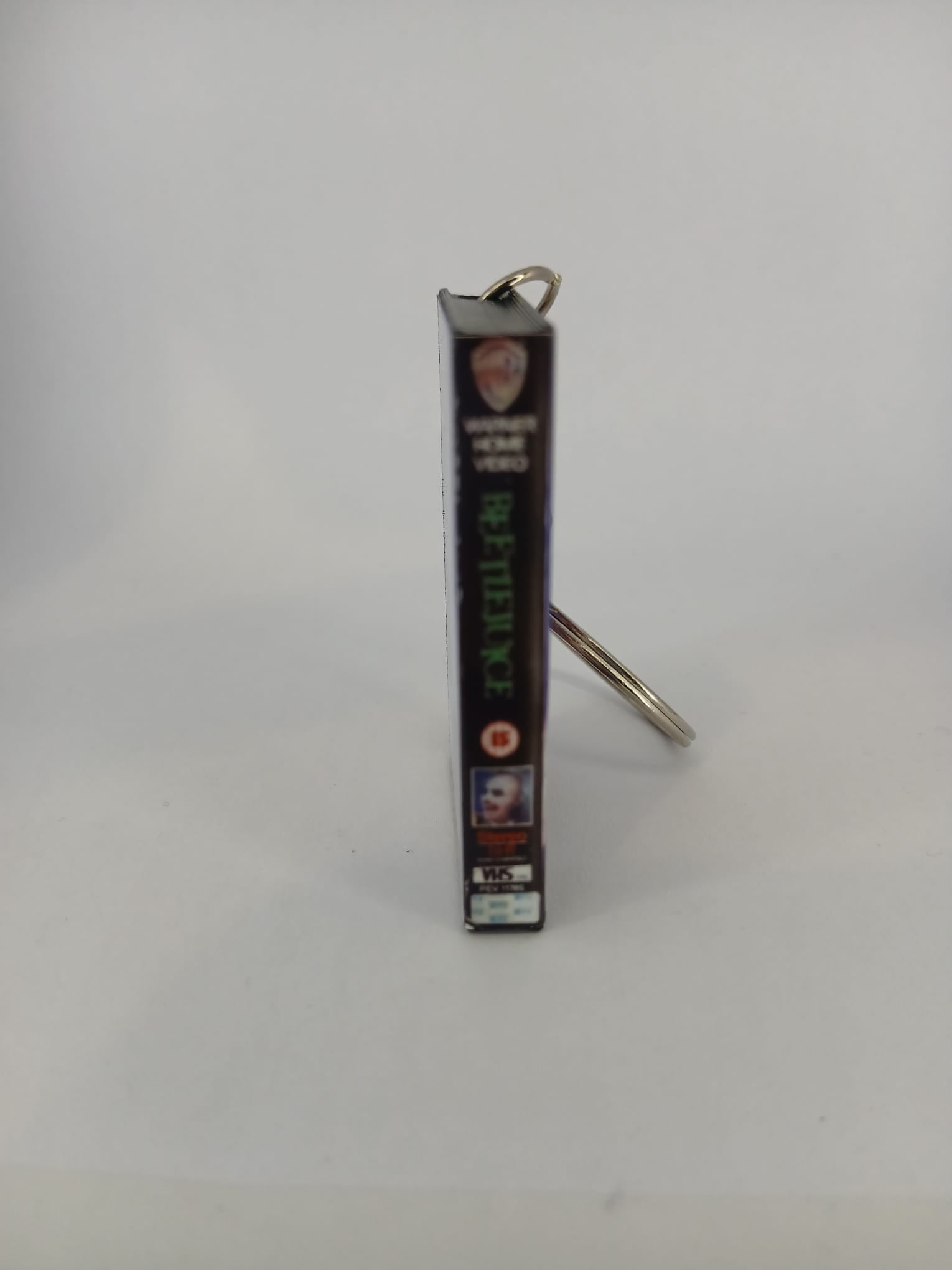 Beetlejuice VHS keyring — front cover standing angled 3
