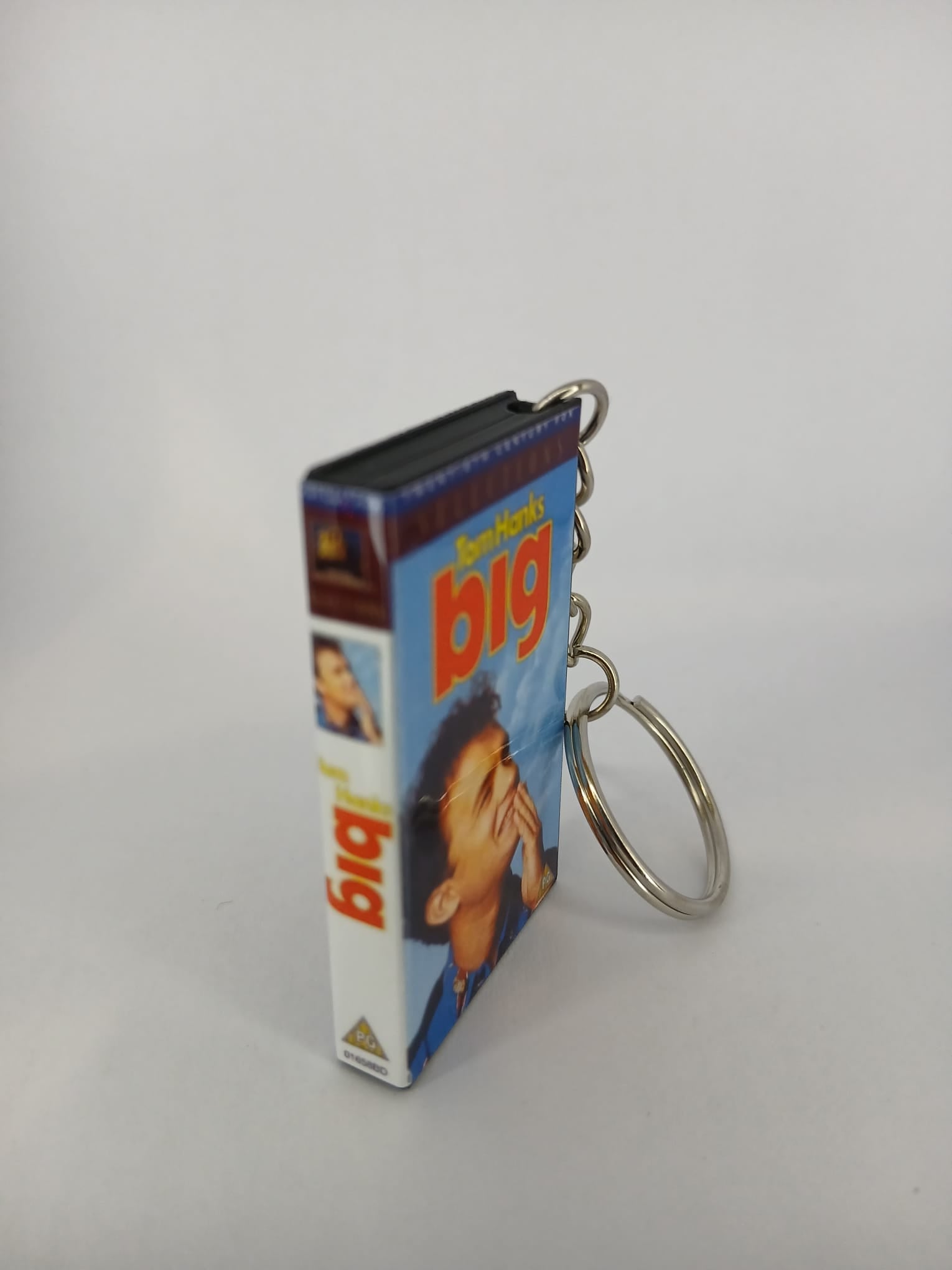 Big VHS keyring — back cover angled view standing