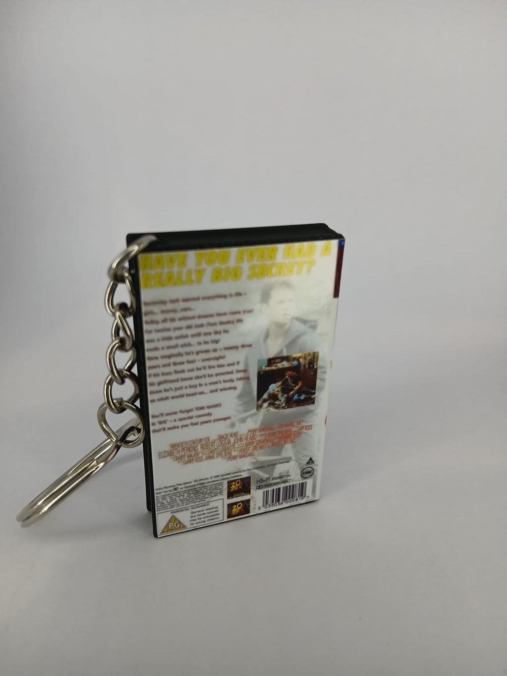 Big VHS keyring — spine view standing