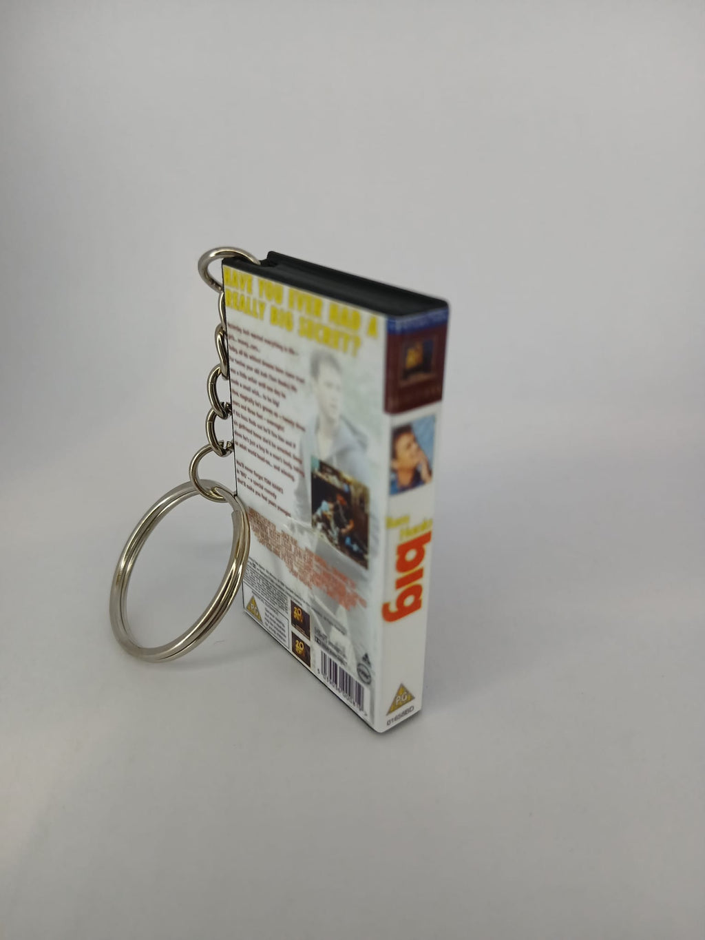 Big VHS keyring — flat lay front and spine angled