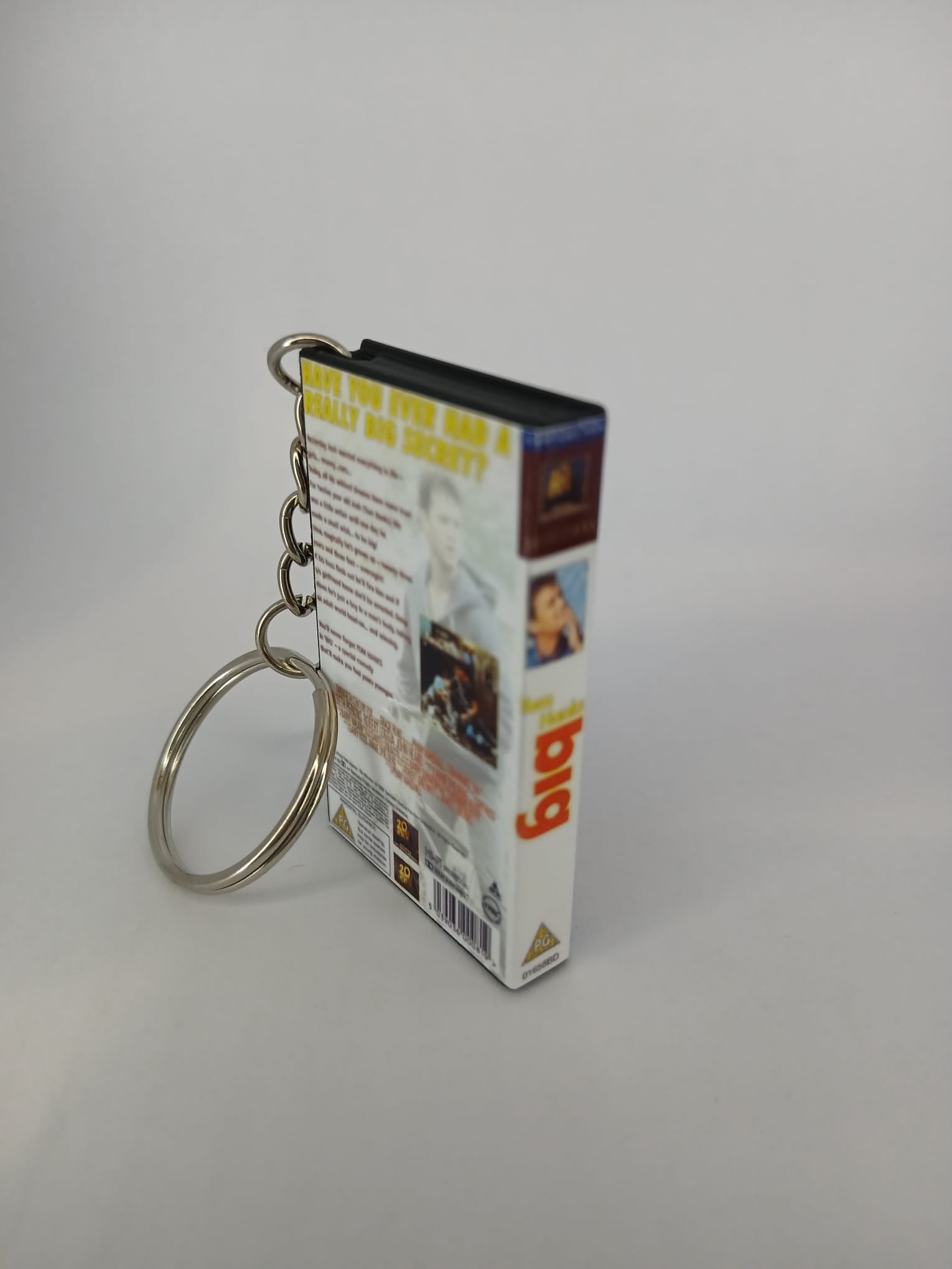 Big VHS keyring — flat lay front and spine angled