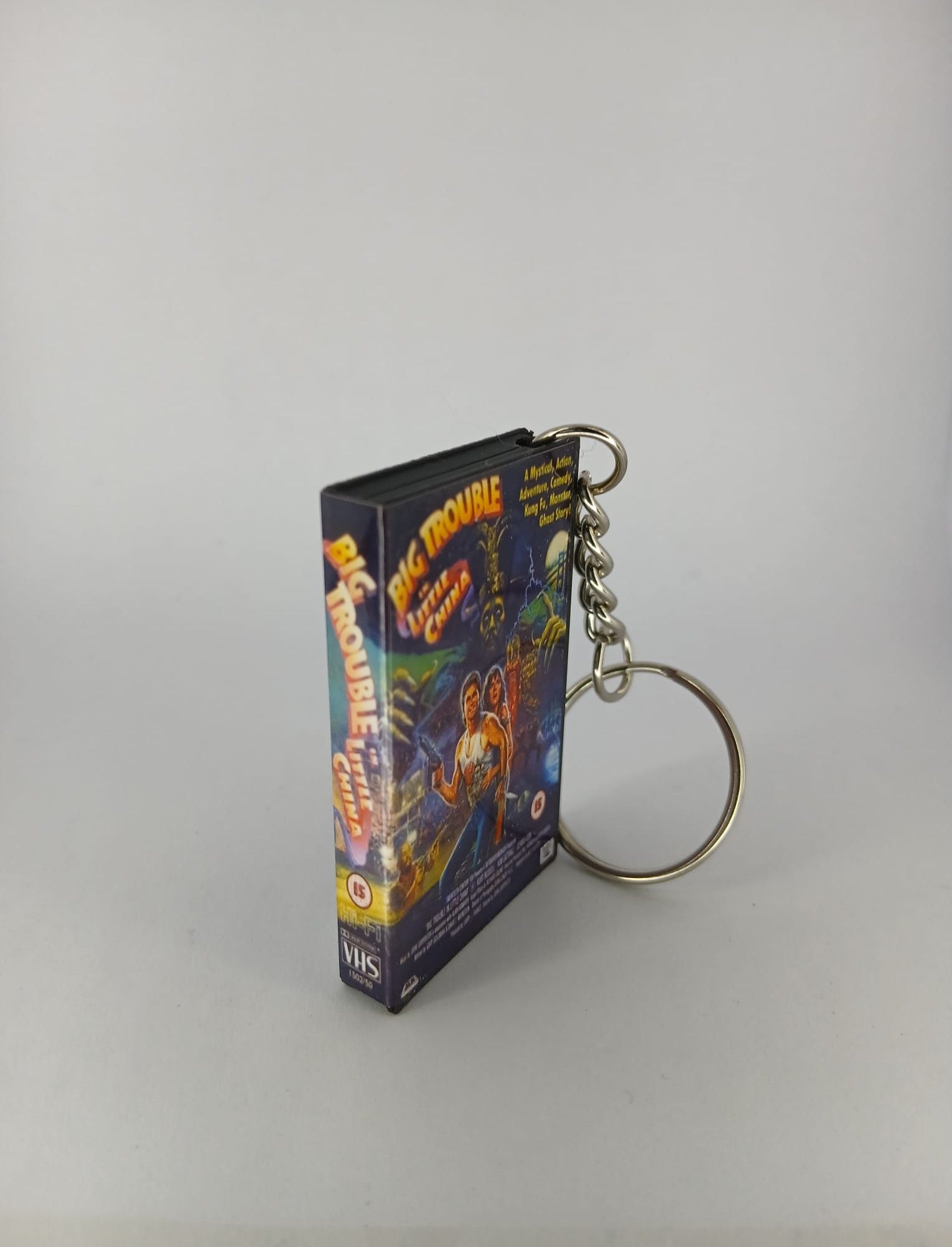 Big Trouble in Little China VHS keyring — spine and back angled view standing