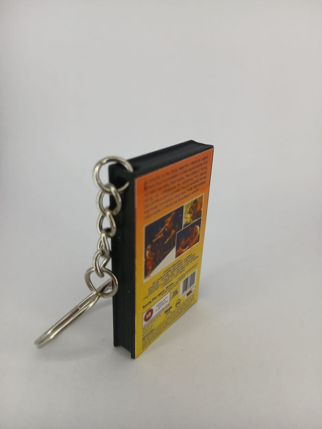Bloodsport VHS keyring — back cover standing angled 2