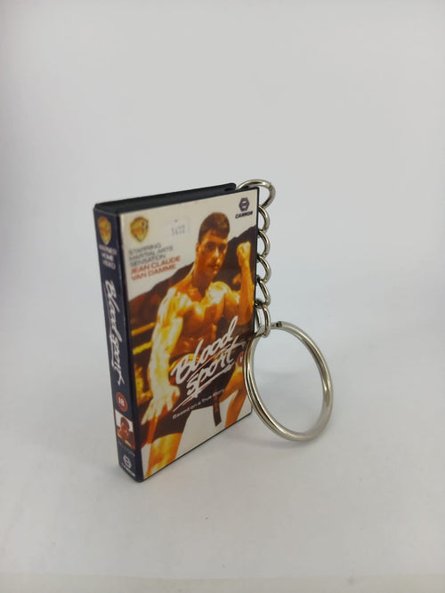 Bloodsport VHS keyring — front cover standing angled 2