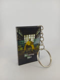 Breaking Bad VHS keyring — front cover standing with coin for scale
