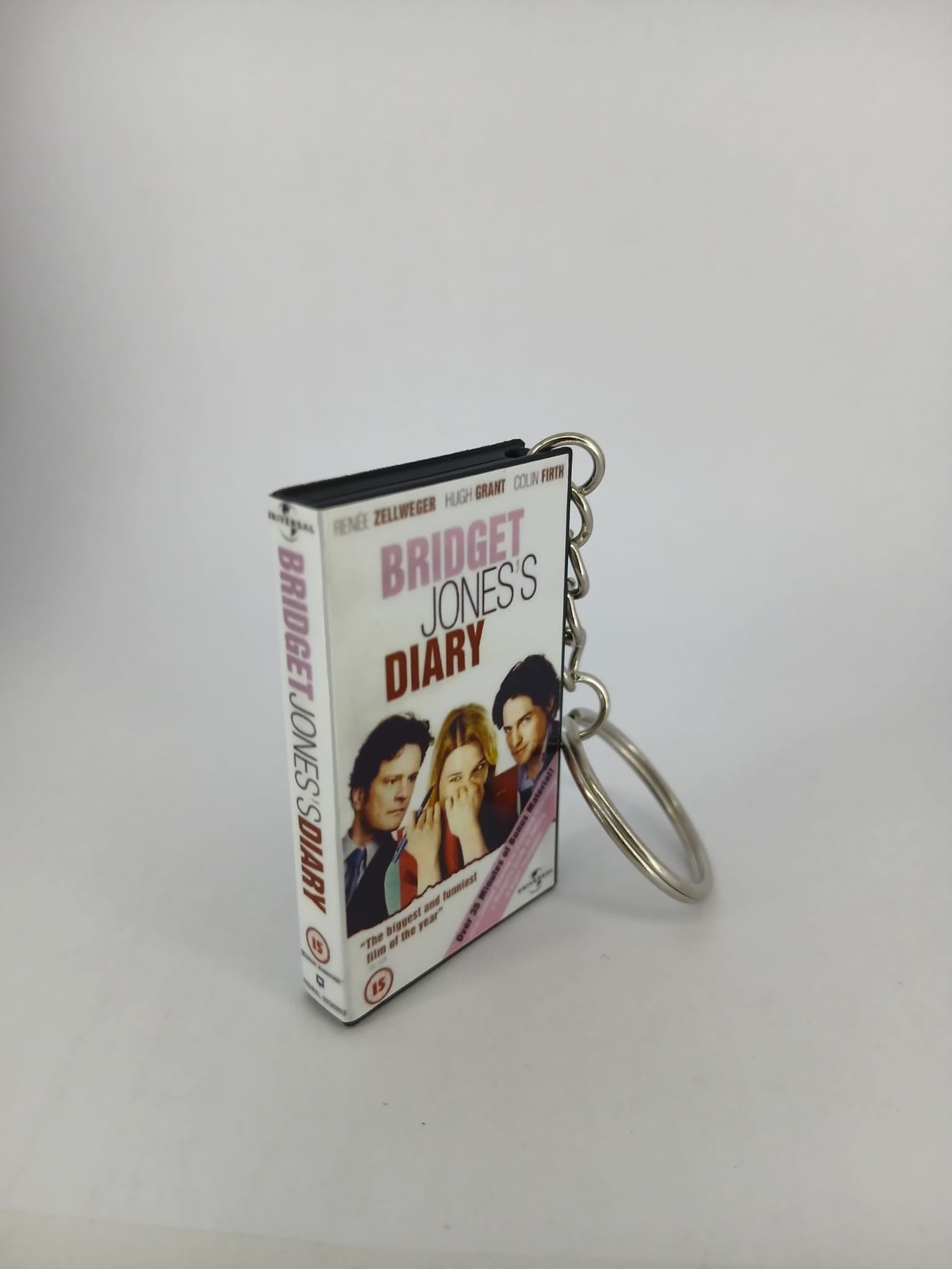 Bridget Jones's Diary VHS keyring — front cover standing with coin for scale