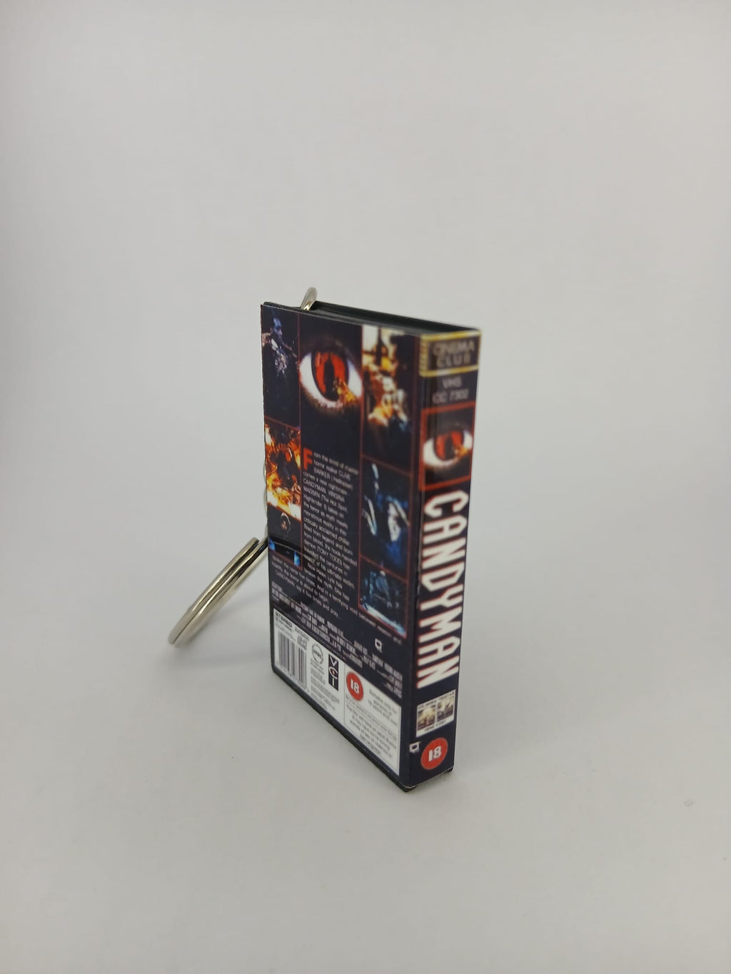 Candyman VHS keyring — front and spine angled view standing