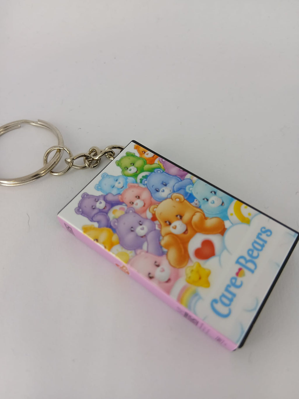 Care Bears VHS keyring flat lay