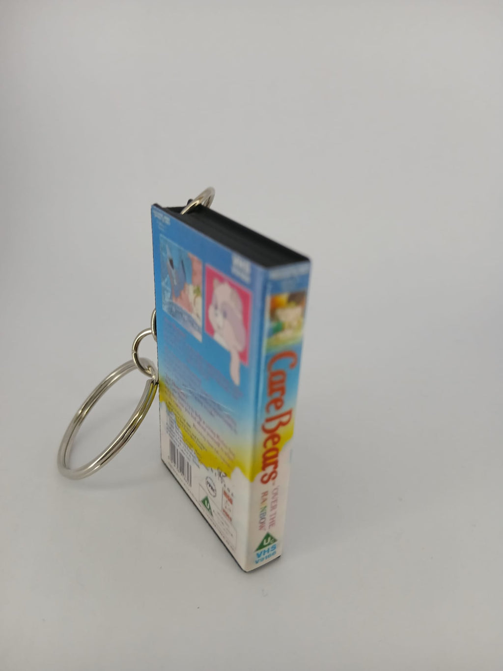 Care Bears VHS keyring — spine view standing