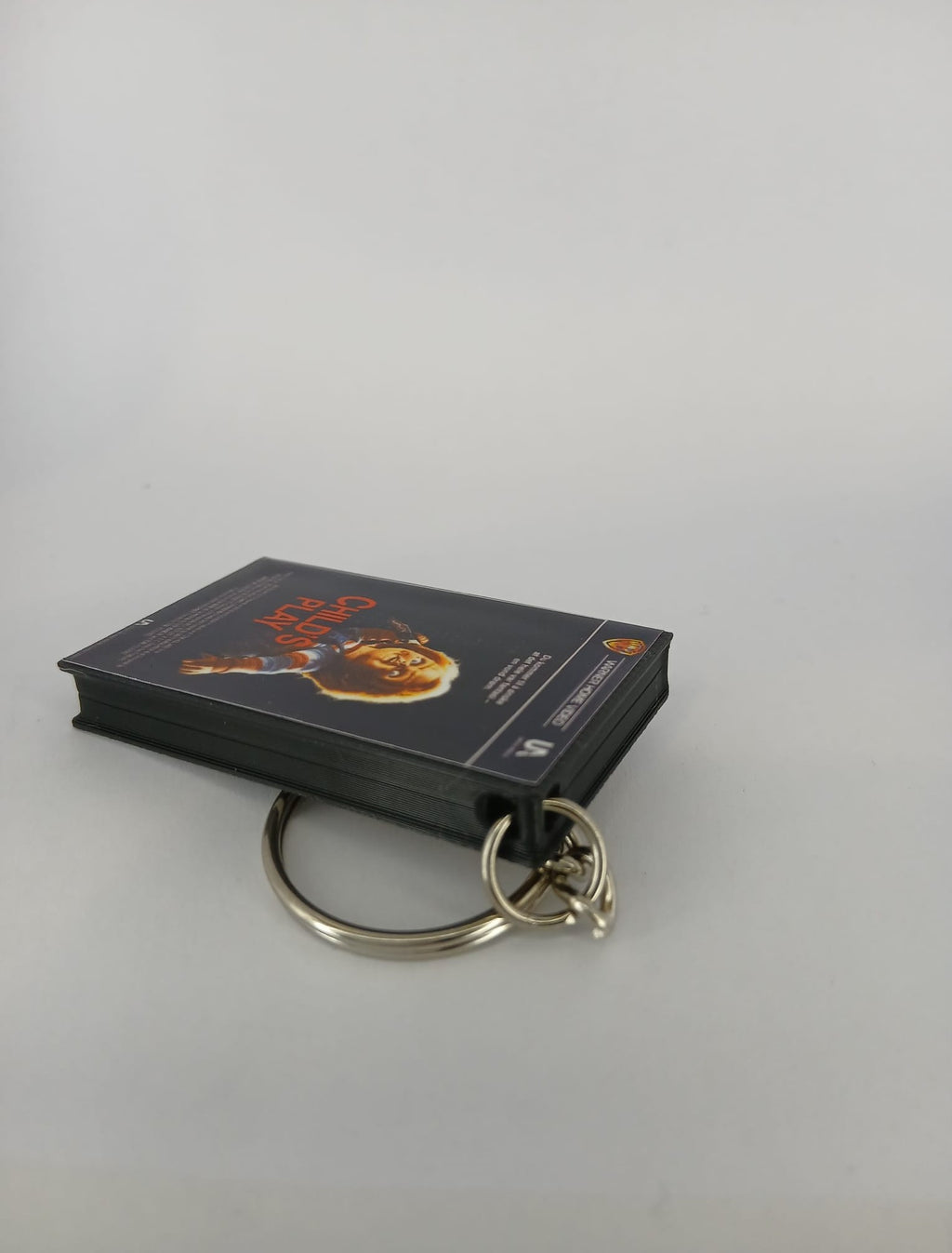 Child's Play Mini VHS Keyring – front with coin