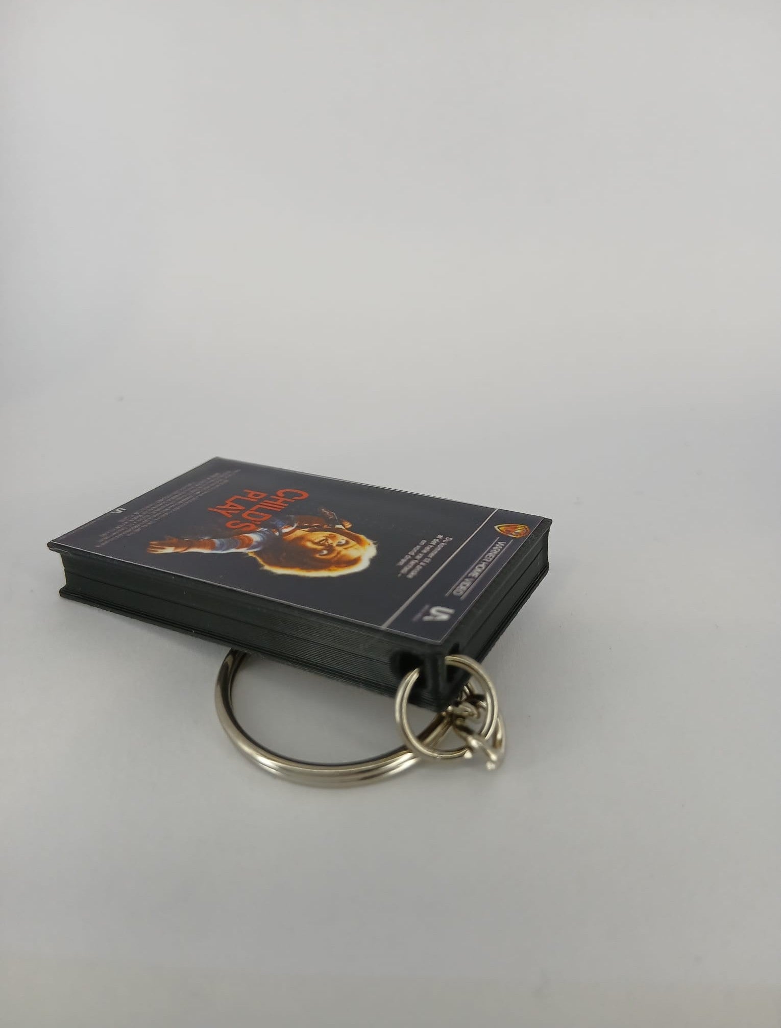 Child's Play Mini VHS Keyring – front with coin