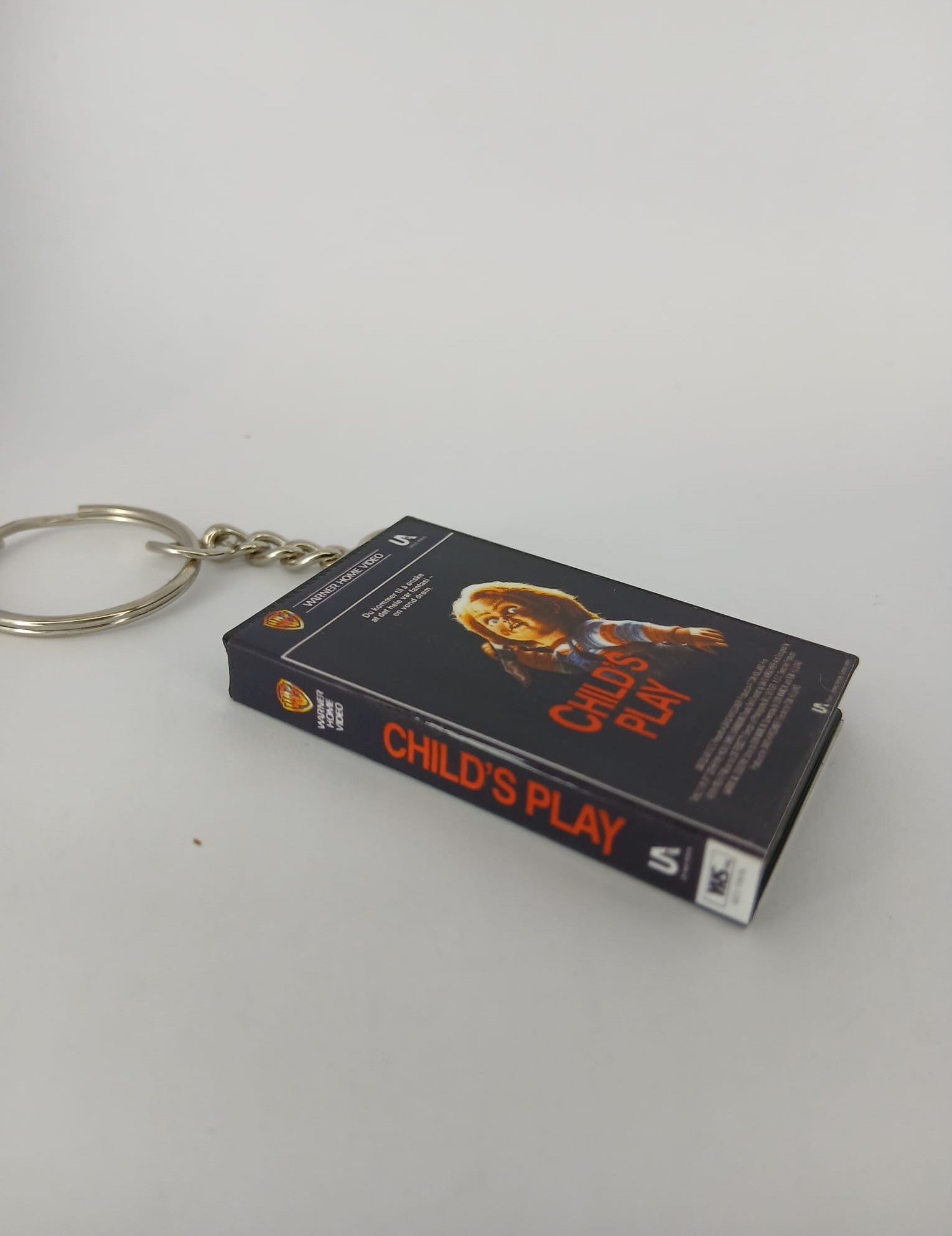 Child's Play Mini VHS Keyring – flat lay overhead