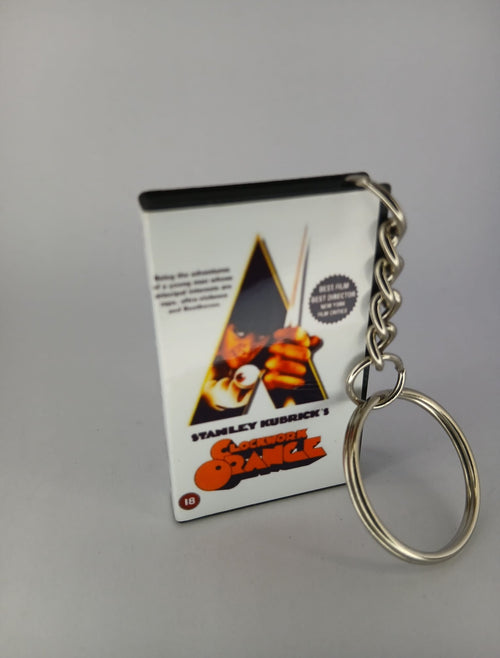 A Clockwork Orange VHS keyring — front cover standing angled 3