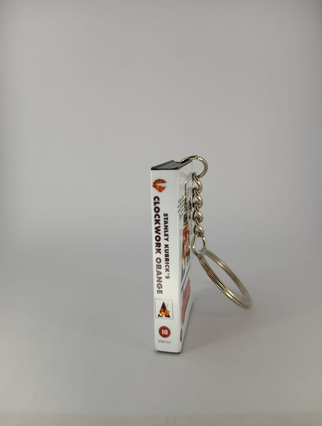 A Clockwork Orange VHS keyring — flat lay overhead showing full wrap
