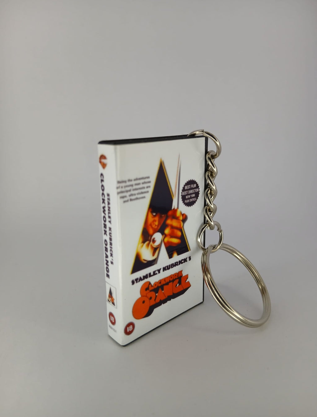 A Clockwork Orange VHS keyring — front cover standing angled 2