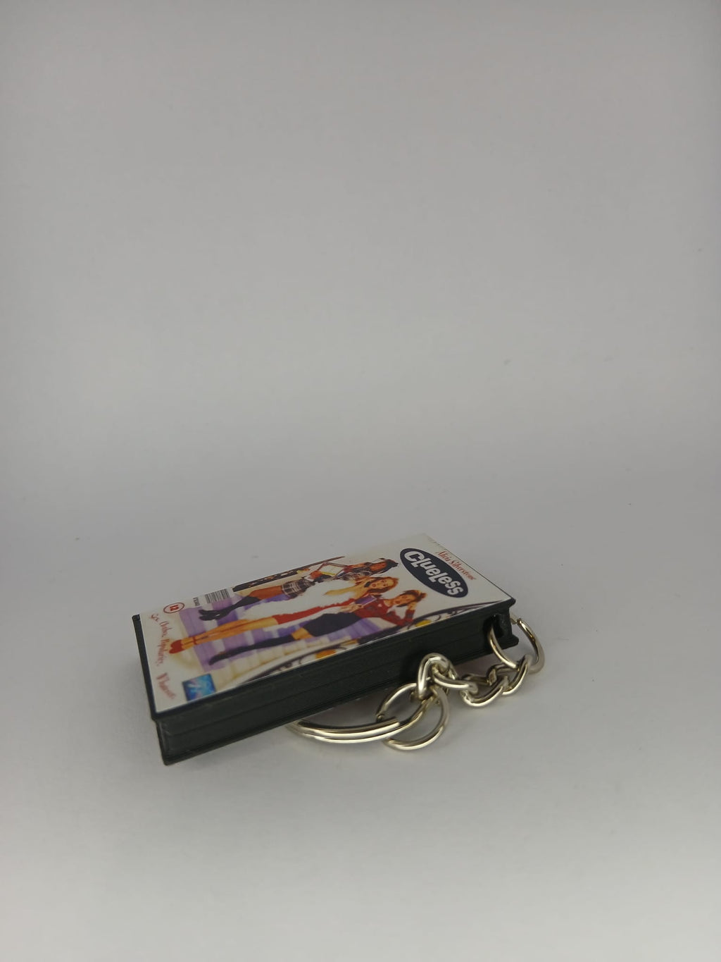 Clueless Mini VHS Keyring – front with coin standing
