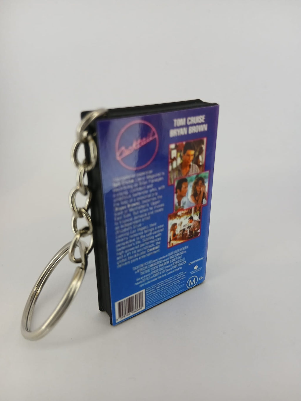 Cocktail VHS keyring — front cover standing angled