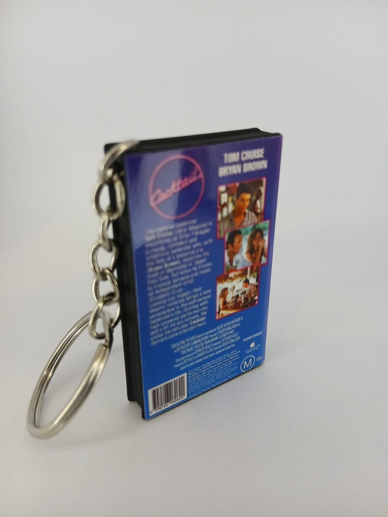 Cocktail VHS keyring — front cover standing angled
