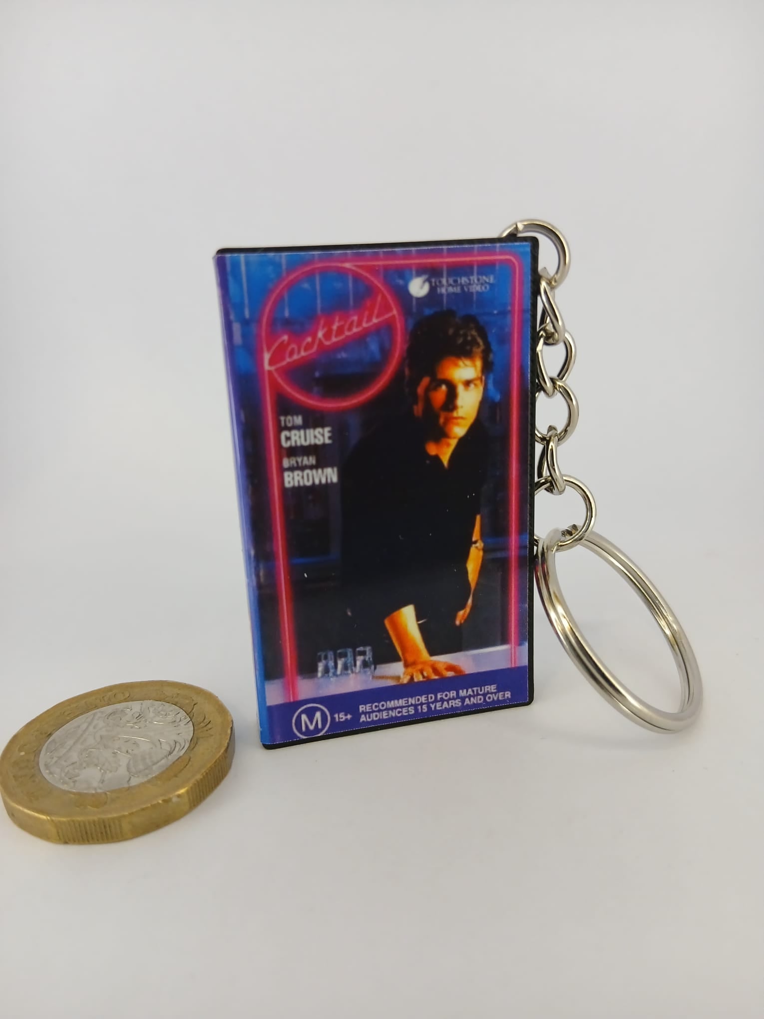 Cocktail VHS keyring — front cover standing angled 2