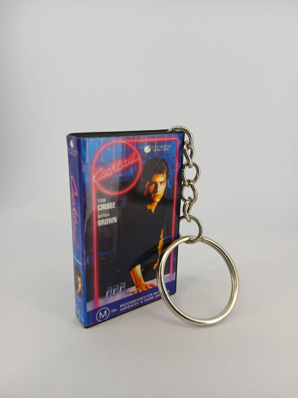 Cocktail VHS keyring — spine view standing