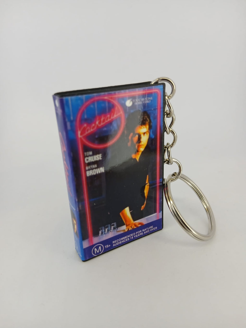 Cocktail VHS keyring — front and spine flat lay angled