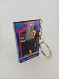Cocktail VHS keyring — front and spine flat lay angled