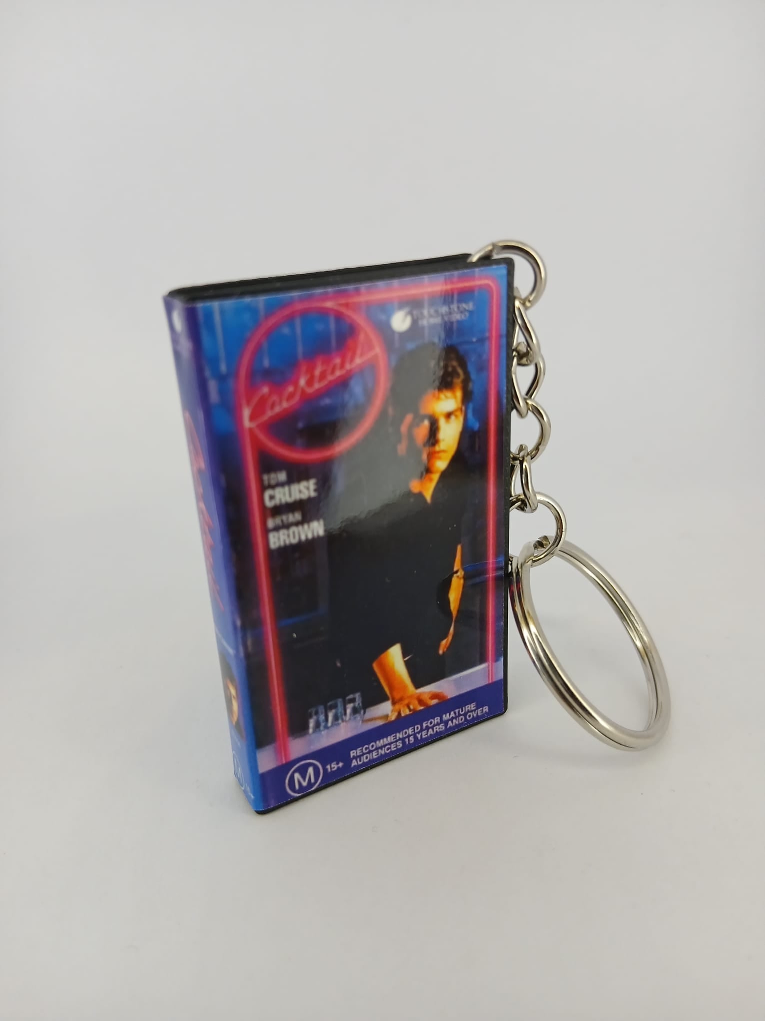 Cocktail VHS keyring — front and spine flat lay angled
