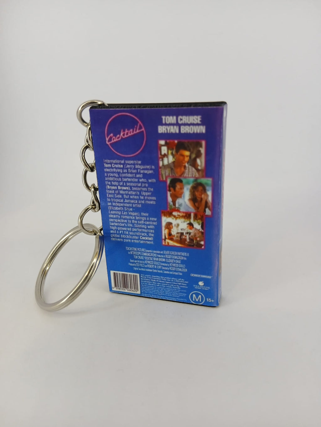 Cocktail VHS keyring — back and spine angled view standing