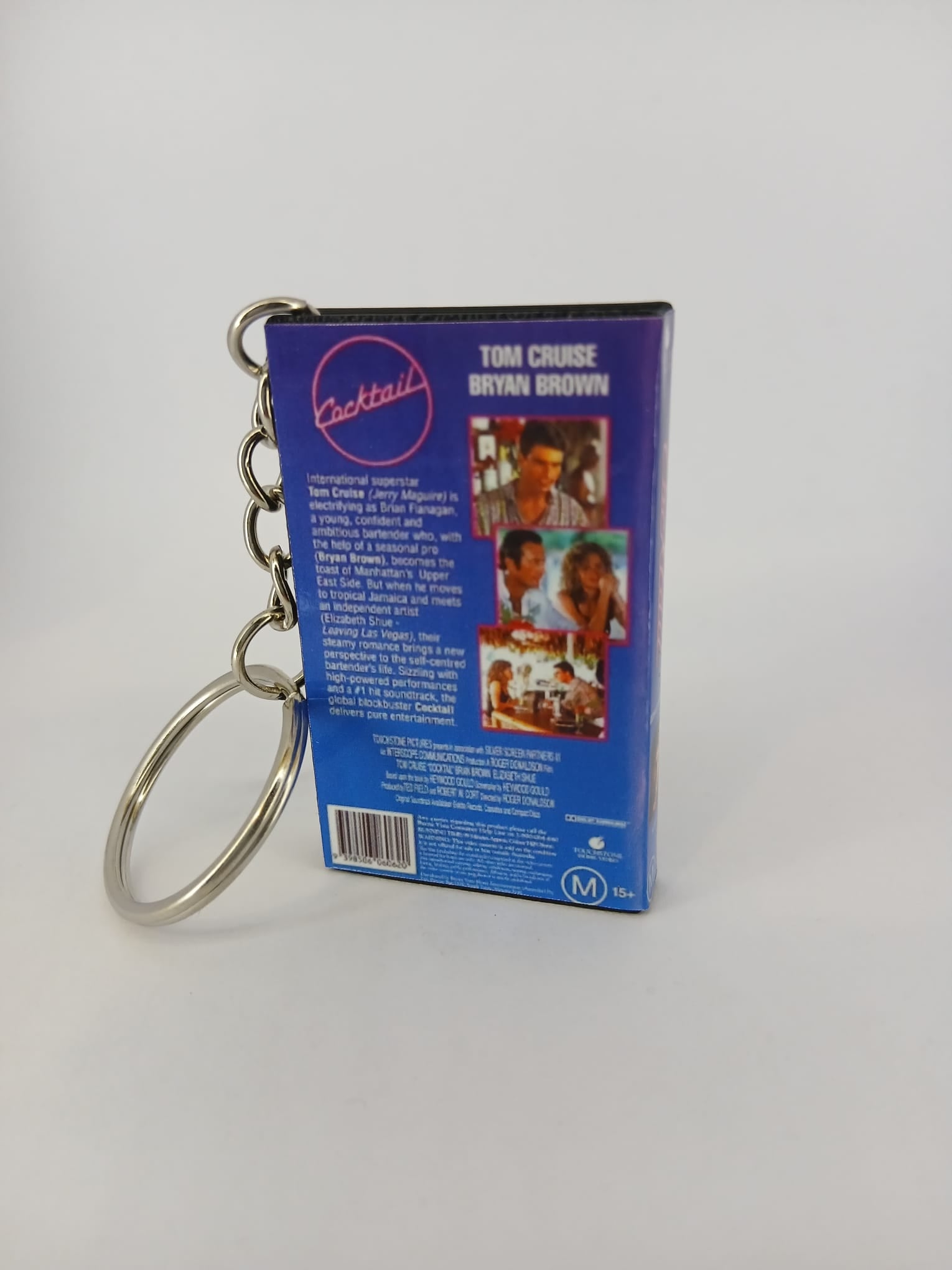 Cocktail VHS keyring — back and spine angled view standing