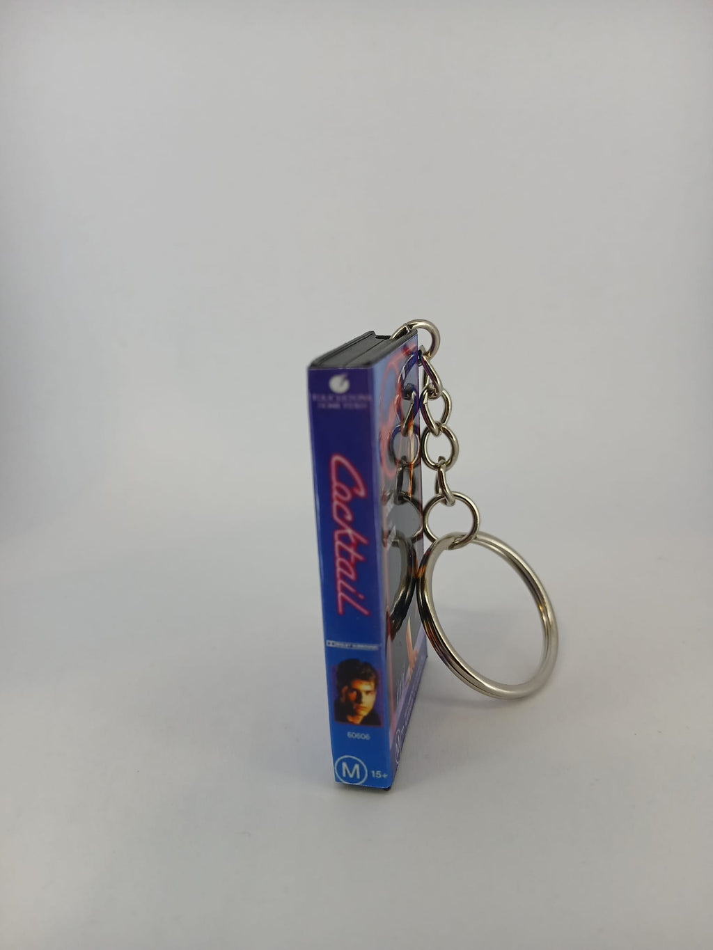 Cocktail VHS keyring — front cover standing angled 3