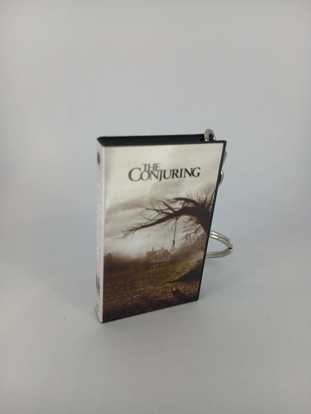 The Conjuring VHS keyring — front cover close-up