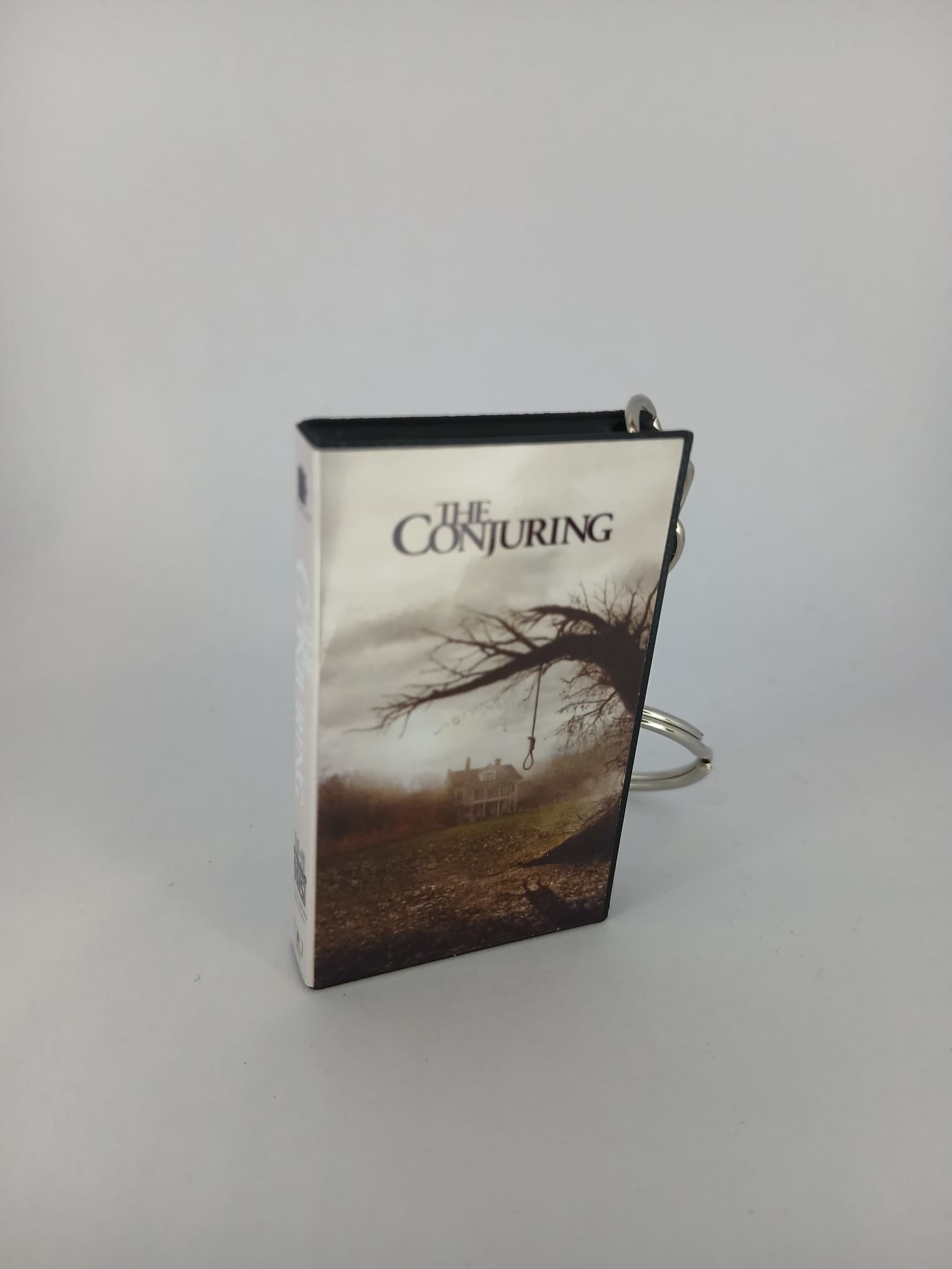 The Conjuring VHS keyring — front cover close-up