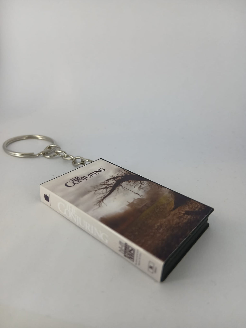 The Conjuring VHS keyring — flat lay top view