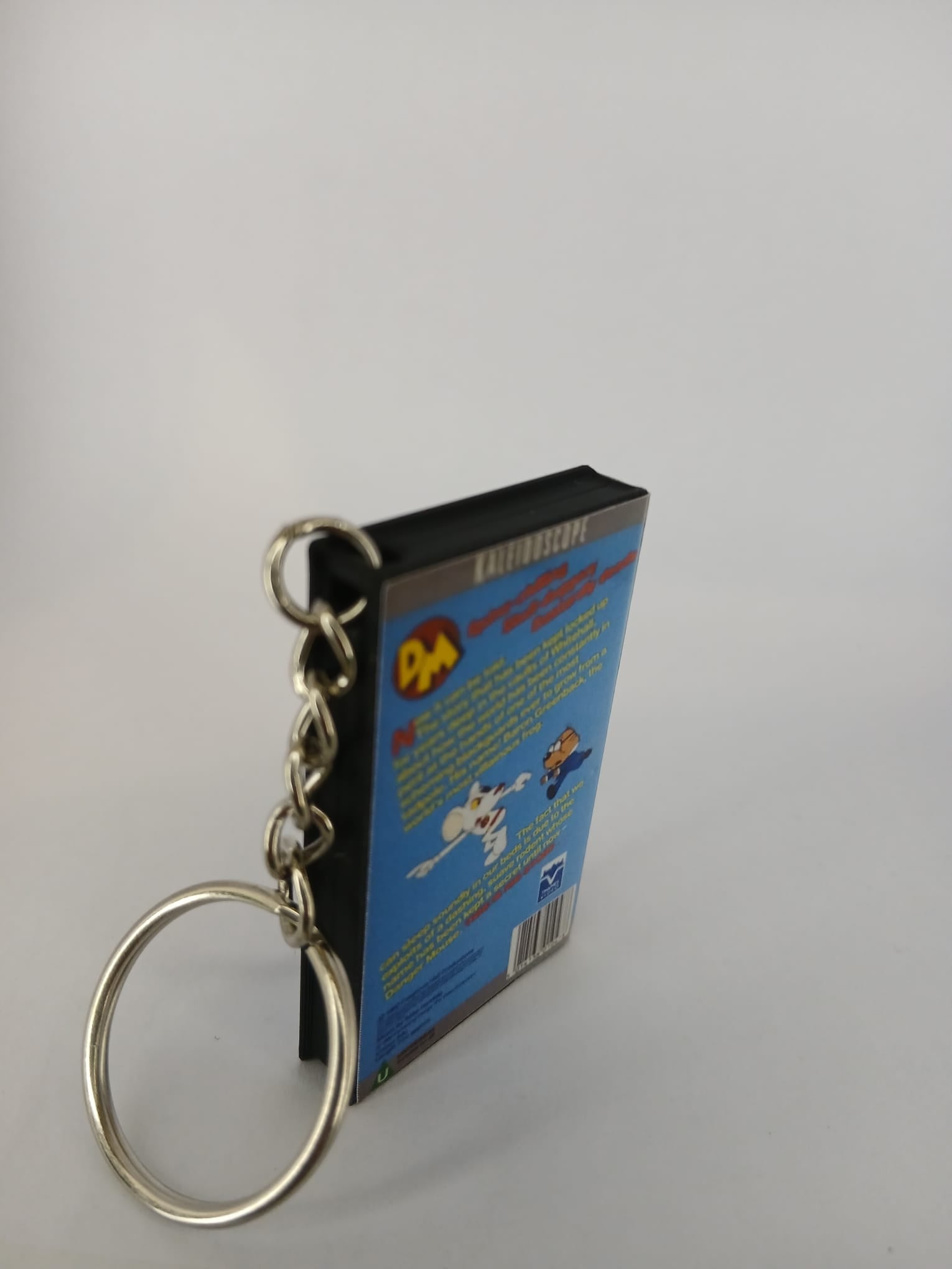 Danger Mouse VHS keyring — spine view standing