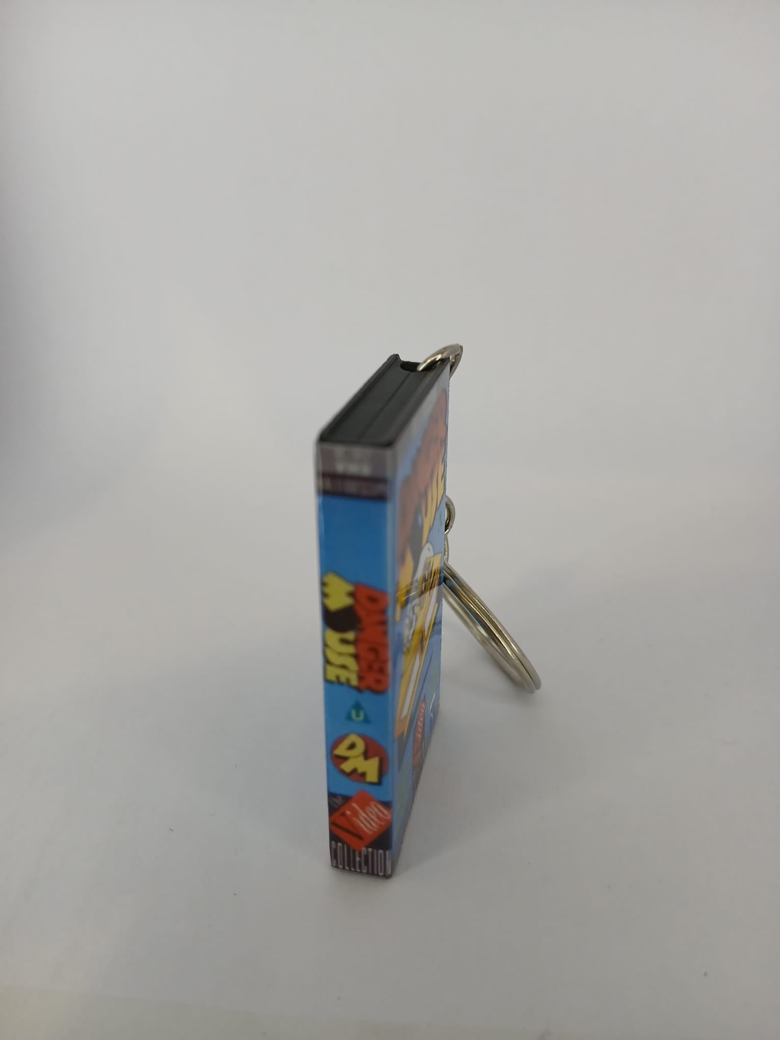 Danger Mouse VHS keyring — front cover standing angled