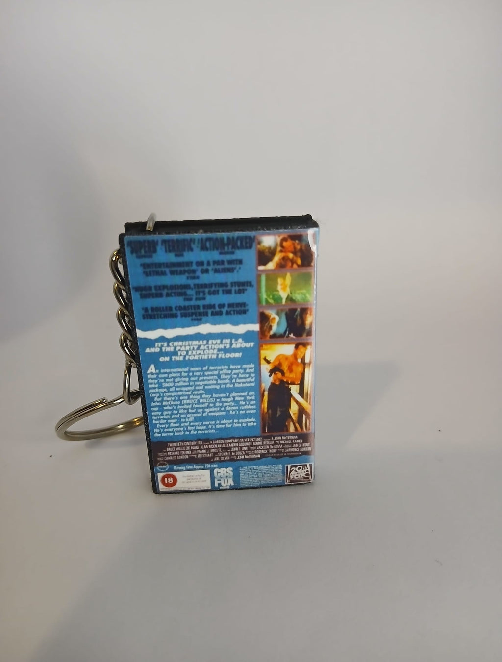 Die Hard VHS keyring — front cover standing angled 2