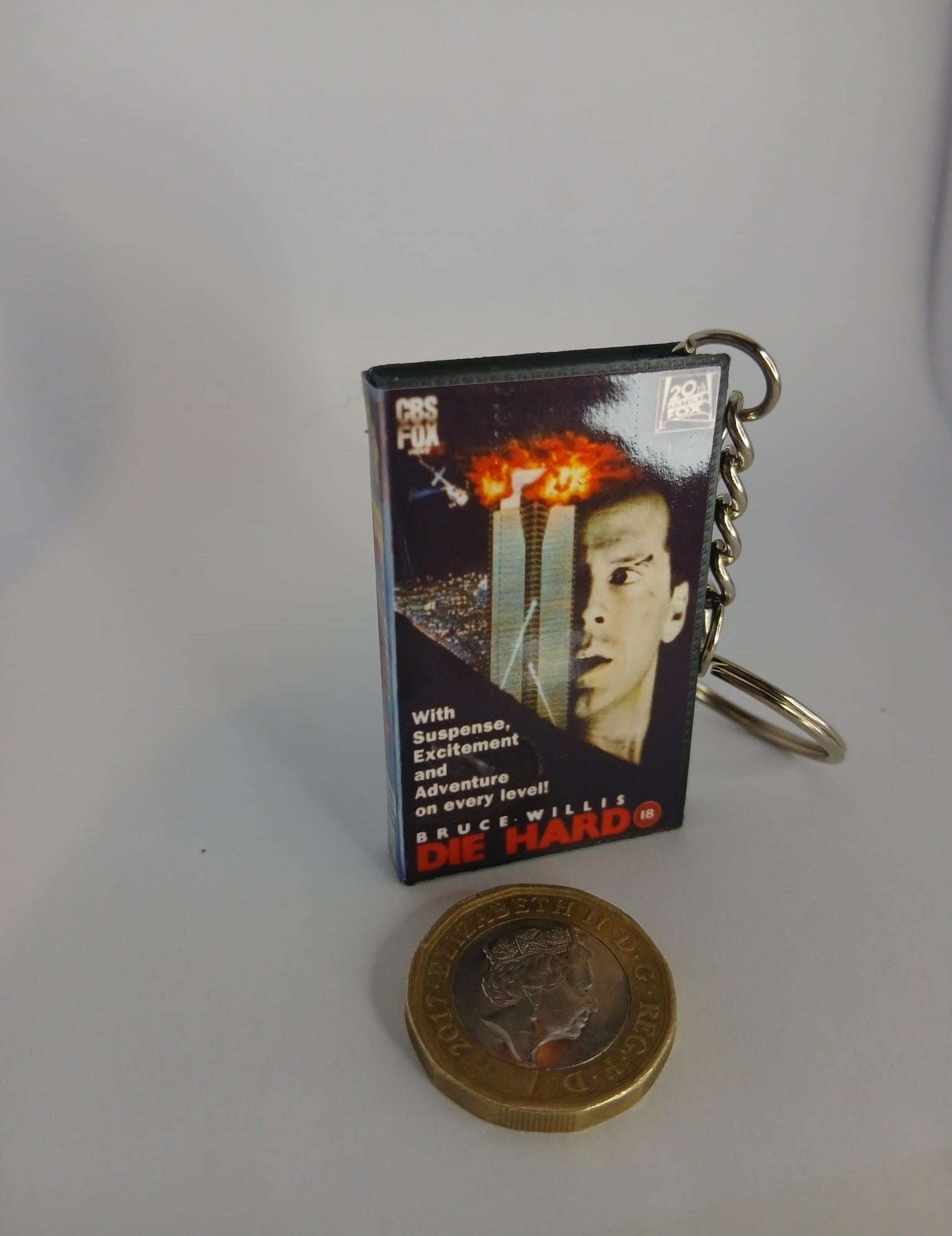 Die Hard VHS keyring — flat lay front and back angled