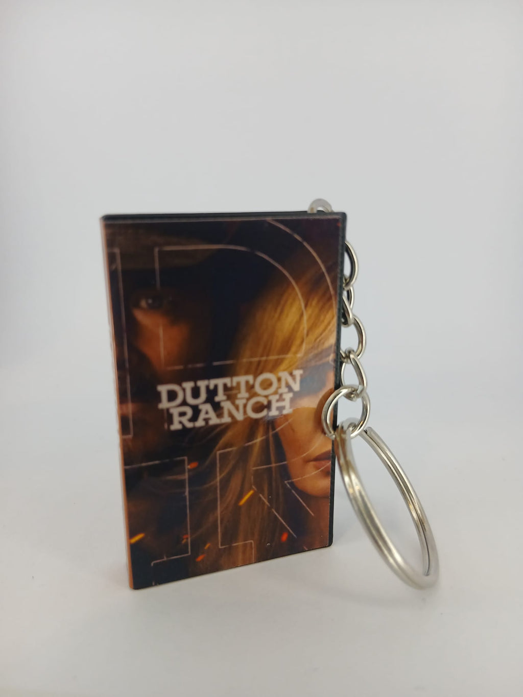 Dutton Ranch VHS keyring — front and spine angled view standing