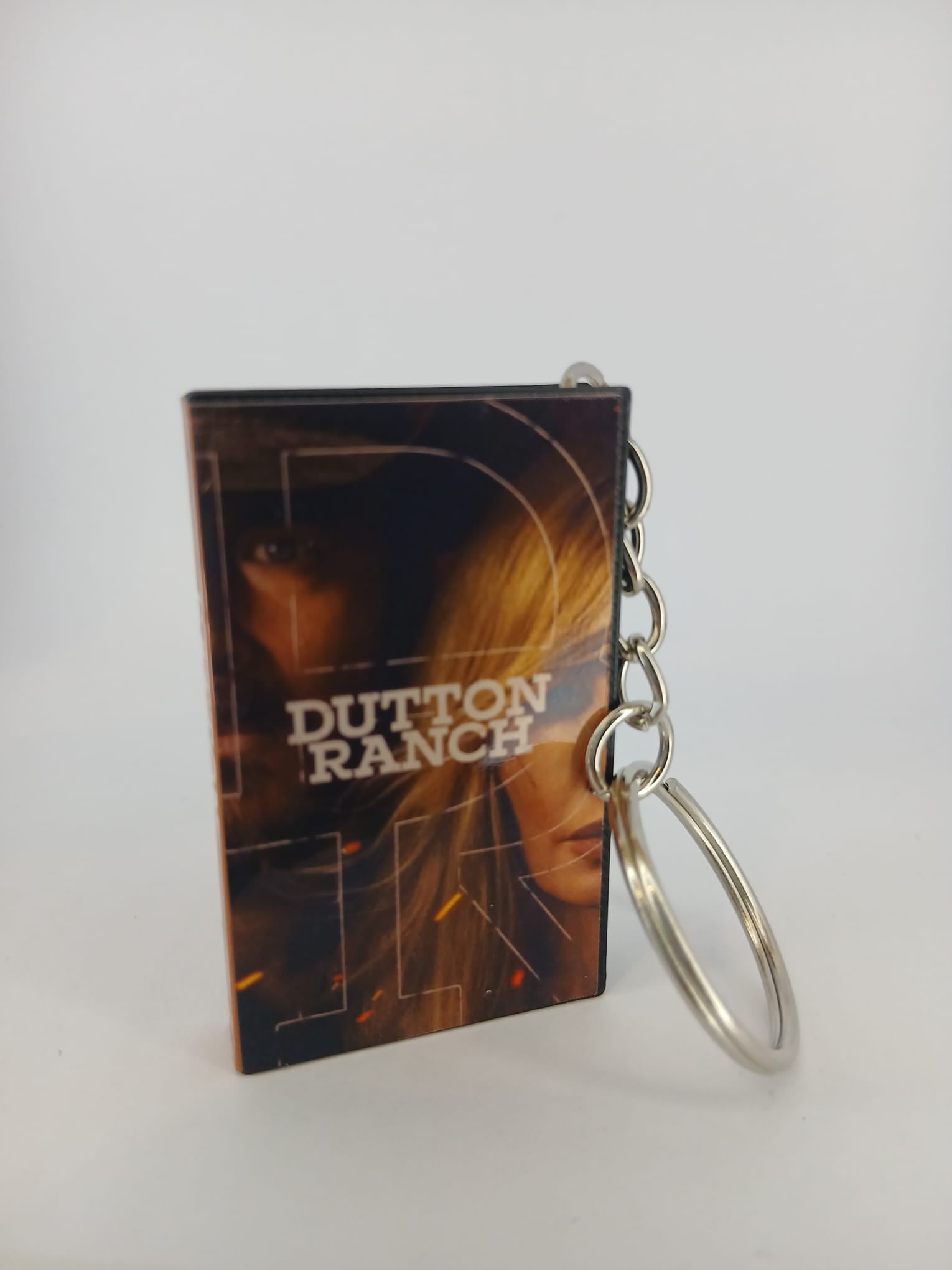 Dutton Ranch VHS keyring — front and spine angled view standing